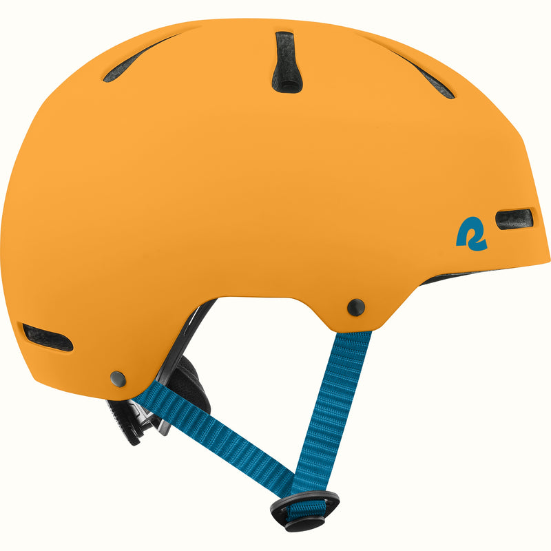 Side profile of the retrospec Dakota orange bike helmet for kids with a matte finish, vents, and teal side straps.