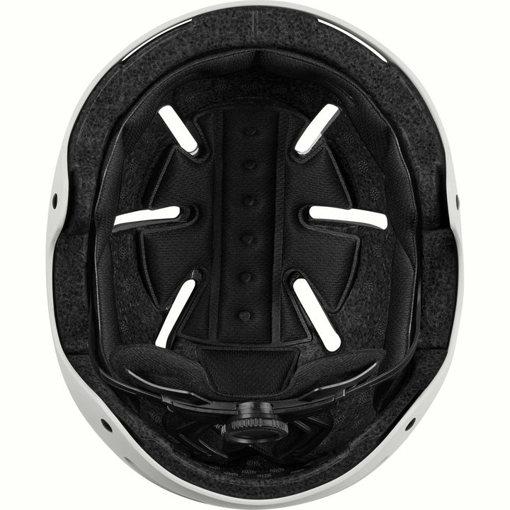 Interior of the retrospec Dakota youth helmet with a black padded liner, vent channels, and fit dial inside an off-white shell.
