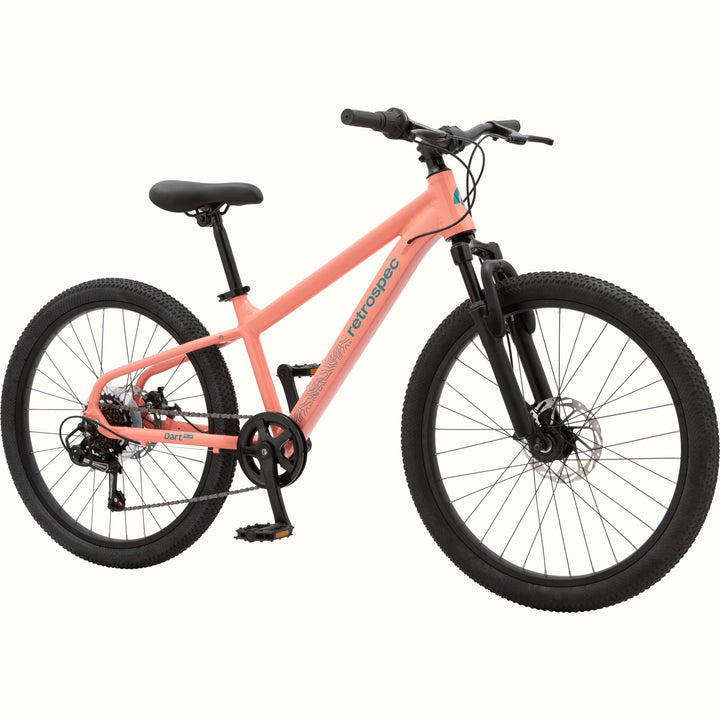 The Dart Plus 24" Kids' Bike in Fairy Floss Salmon color with blue-gray branded "retrospec" and "Dart Plus" logos on the frame, and thick black tires isolated on a white background.