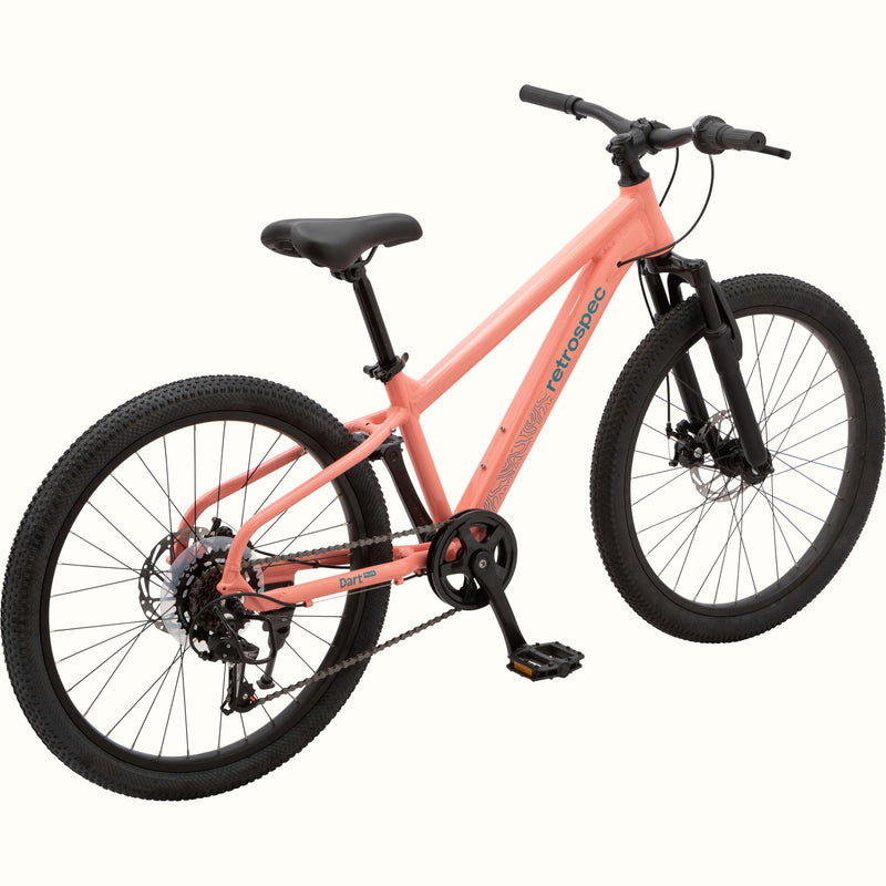 View of the Dart Plus 24" Kids' Bike in Fairy Floss Pink color with blue-gray branded "retrospec" and "Dart Plus" logos on the frame, and thick black tires isolated on a white background.