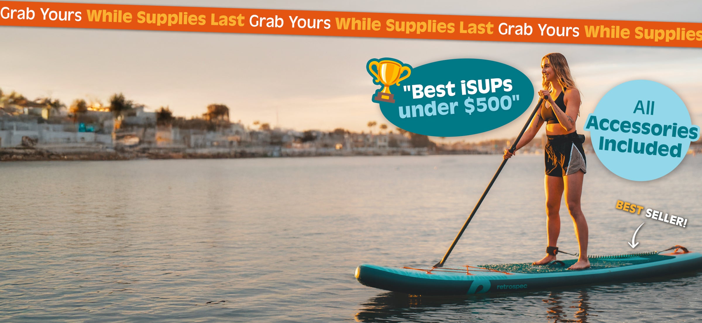Woman paddling a retrospec inflatable Paddle Board across calm water at sunset.