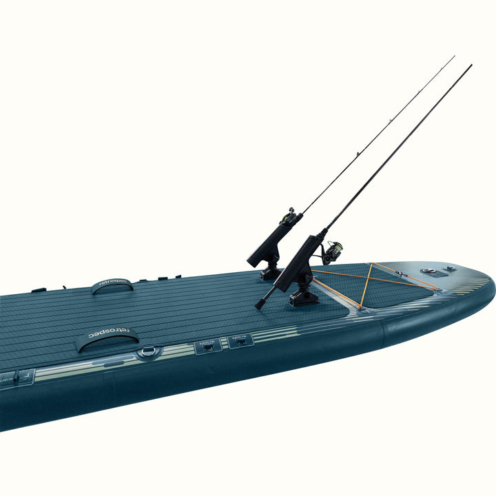 Inflatable paddleboard equipped with two fishing rod holders, carrying handles, and bungee cord storage on the front deck.