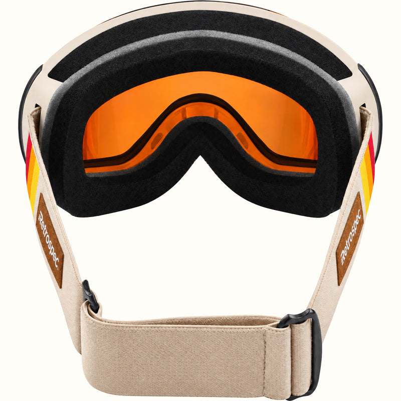 Inside view of retrospec Traverse Plus goggles showing black face foam and the adjustable cream strap with black buckles.