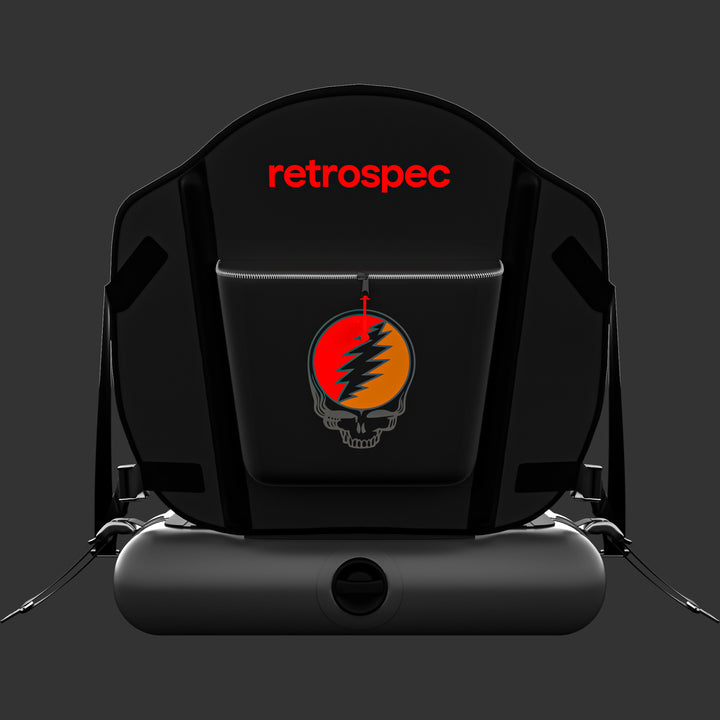 A rear view of the sleek black Grateful Dead AerComfort Inflatable Kayak Seat with a high back, featuring adjustable straps, zipper storage, and the iconic Grateful Dead "Steal Your Face" or "SYF" artwork with a red  retrospec logo on the seat back.