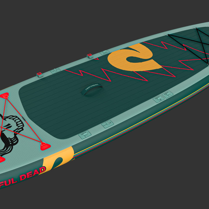 The Grateful Dead Weekender Plus Inflatable Paddle Board featuring the iconic "Steal Your Face" or "SYF" design, a large yellow "retrospec" logo, and red lightening bolts on a textured surface for grip.