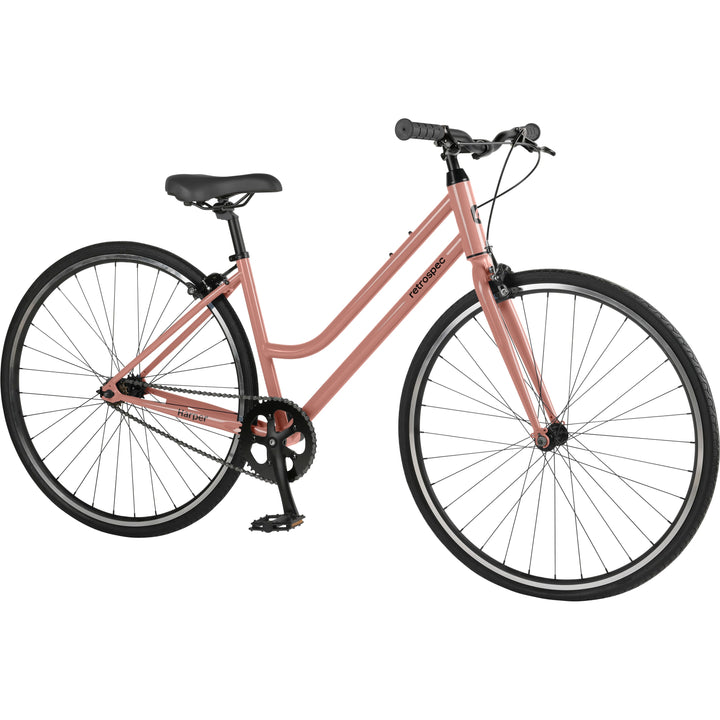 A pink single-speed fixie bicycle with black wheels on a white background.