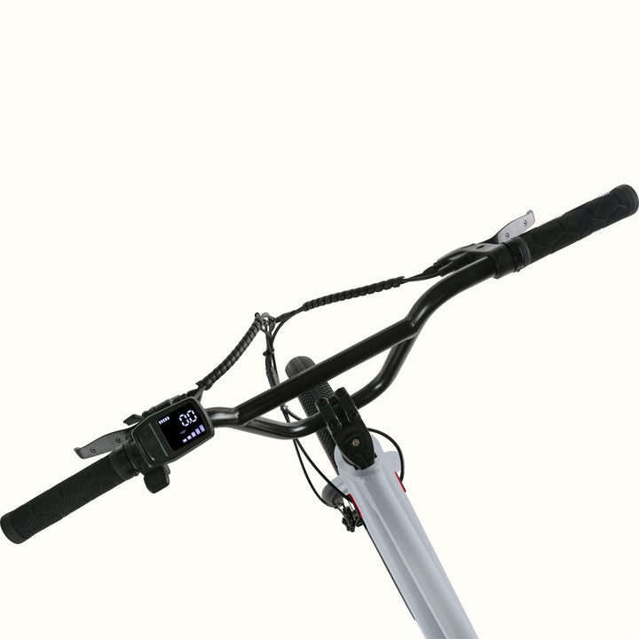 Close-up of the gray Joe Rev 2 BMX Electric Bike's handlebar with digital display on a white background.