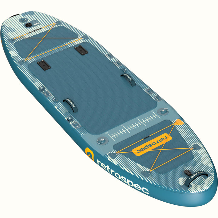 A blue and white camo June Nano Kids’ Inflatable Fishing Paddle Board/Kayak Hybrid with the seat removed, showcasing the storage straps, and measurement guide, designed for fishing.