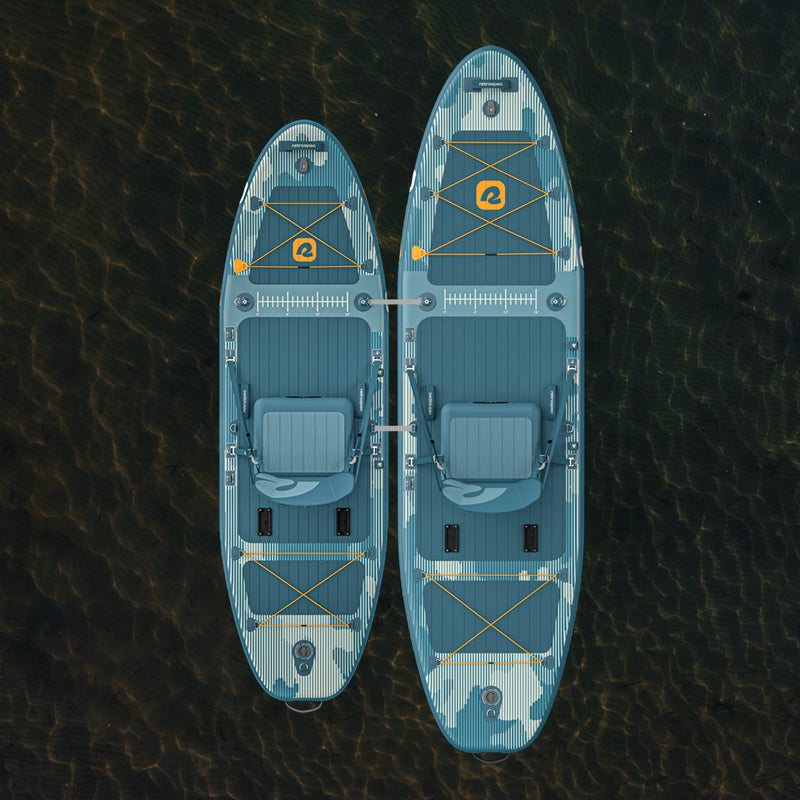 An aerial view of the June Inflatable Fishing Paddle Board Kayak Hybrid 11’6” and June Nano Kids’ Inflatable Fishing Paddle Board Kayak Hybrid tethered together on a calm body of water.