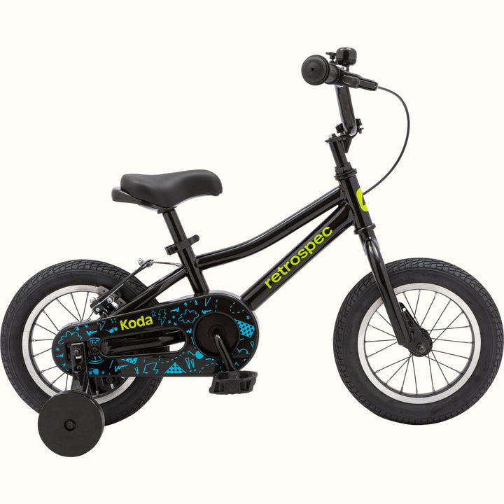 Black and blue children's bike with training wheels and patterned chainguard.