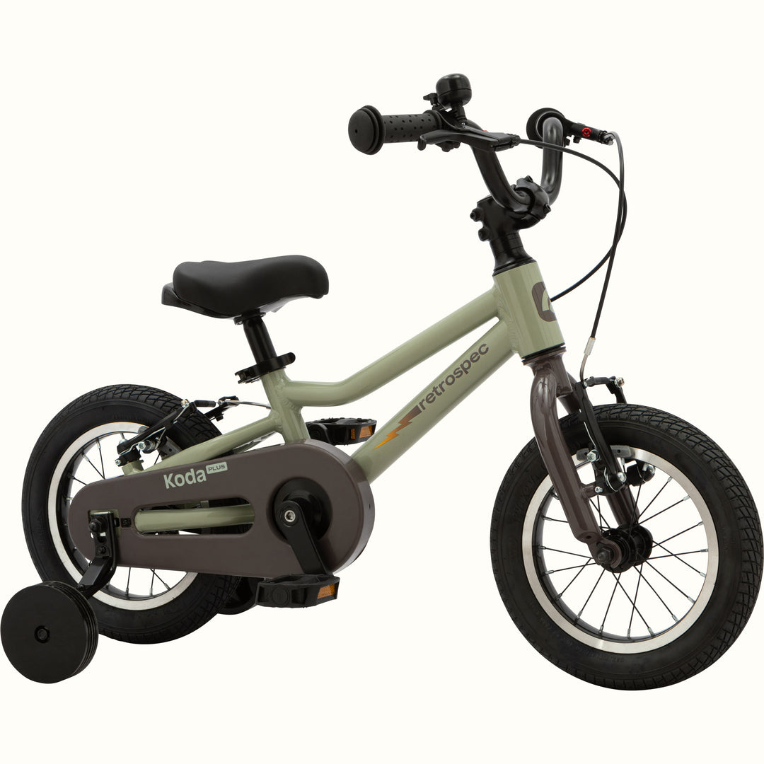 Koda Plus Iguana children's bike with training wheels, green frame, and black details.