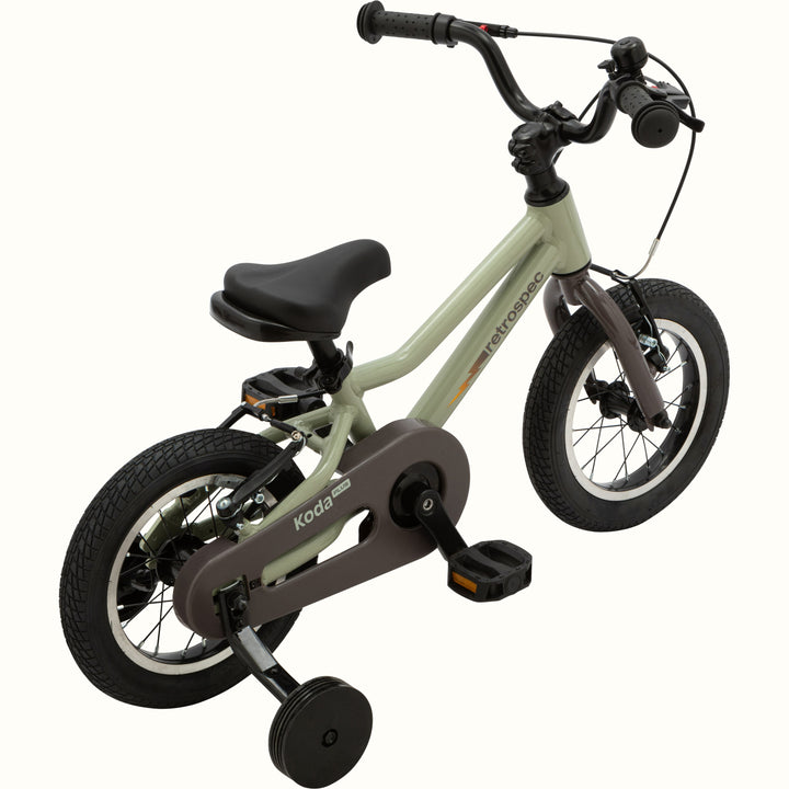 Koda Plus 12 inch Iguana Kids' bike with training wheels, green frame, brown chainguard, and black details.