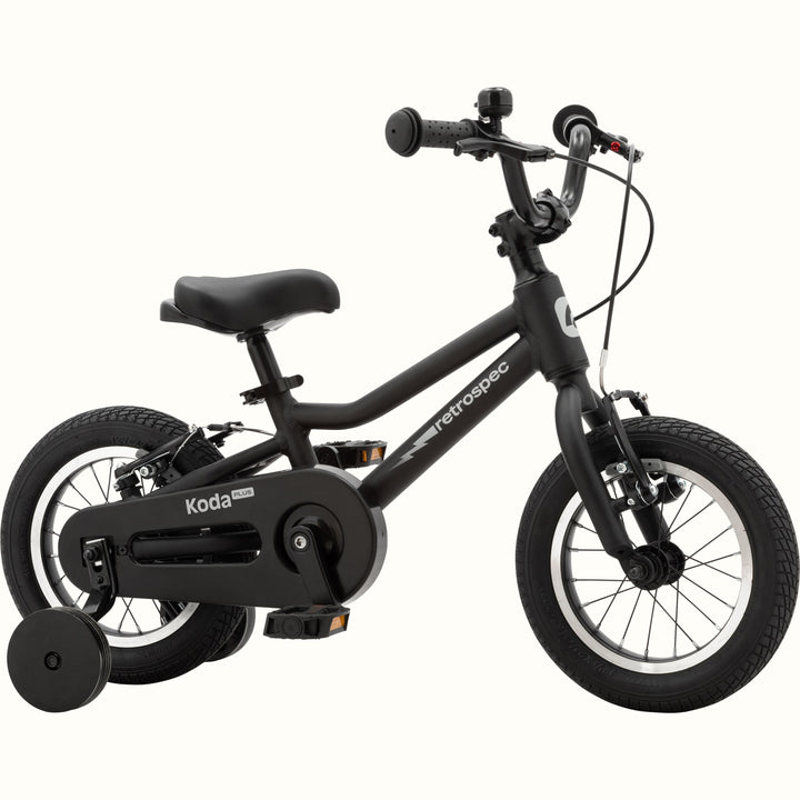 Koda Plus 12 Inch Kids' Bike in Matte Black with training wheels, a lightning bolt on the frame, and a black chainguard.