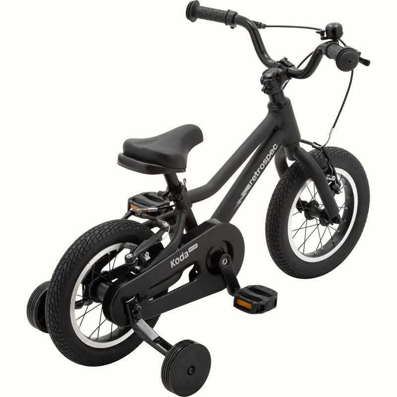 Koda Plus 12 Inch Kids' Bike in Matte Black with training wheels, a lightning bolt on the frame, and a black chainguard.