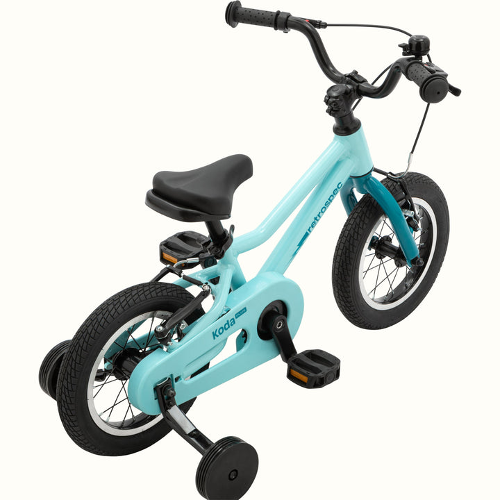 Koda Plus 12 Inch Kids' Bike in Robin's Egg with training wheels, a lightning bolt on the frame, and a blue chainguard.