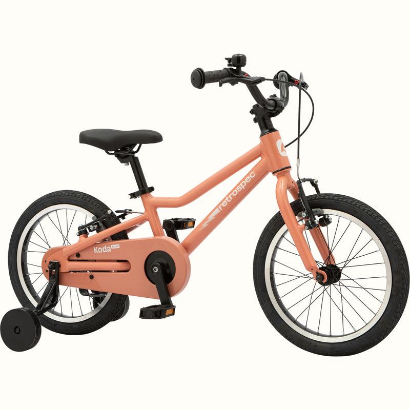 Kids' Koda Plus 16 Inch pink rose bike with training wheels isolated on a white background.