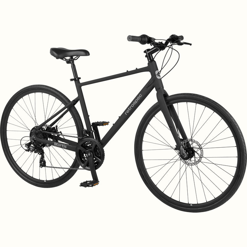 retrospec Martis commuter bike in Matte Black, angled view with flat handlebar, wide saddle, and front disc brake.