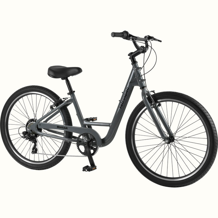 retrospec Montauk 26-inch 7-speed step-through cruiser bike in graphite gray with black tires, saddle, and upright handlebars, shown on a clean white background.