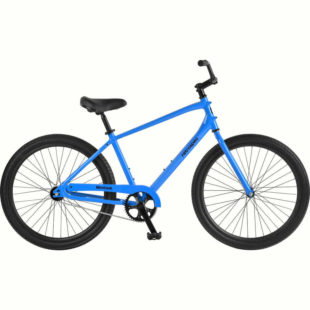retrospec Montauk 26-inch cruiser bike in cobalt blue with black tires, saddle, and upright handlebars, shown on a clean white background.