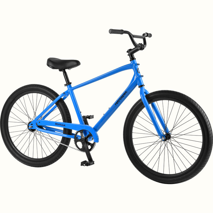 retrospec Montauk 26-inch cruiser bike in cobalt blue with black tires, saddle, and upright handlebars, shown on a clean white background.