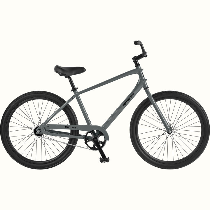 retrospec Montauk 26-inch cruiser bike in graphite with black tires, saddle, and upright handlebars, shown on a clean white background.