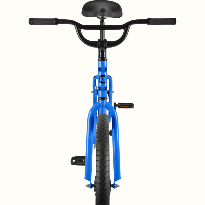 Front view of the retrospec Montauk cruiser bike in cobalt blue, highlighting the wide black handlebars, black saddle, cobalt blue fork, and treaded front tire.