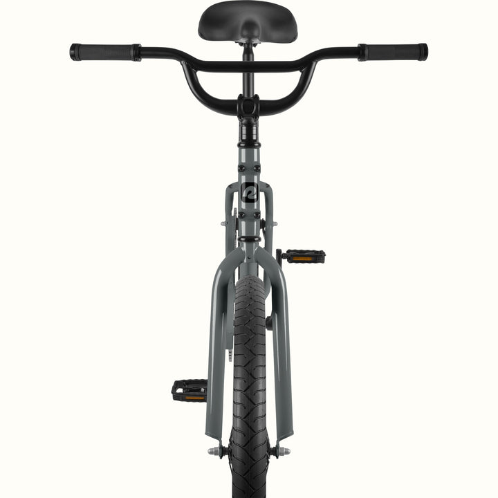 Front view of the retrospec Montauk cruiser bike in graphite, highlighting the wide black handlebars, black saddle, graphite fork, and treaded front tire.