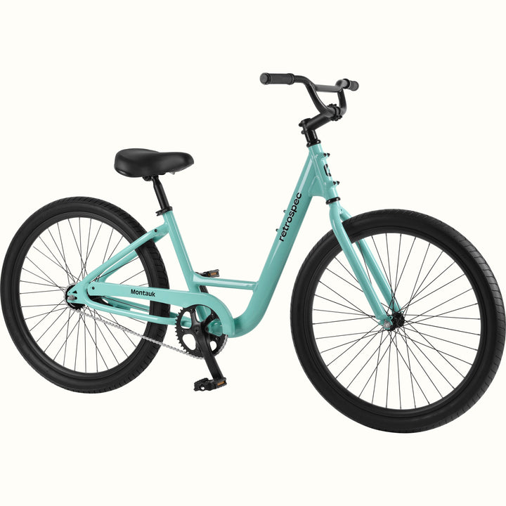 retrospec Montauk cruiser bike in seafoam with a low step-through frame, black tires, saddle, and upright handlebars, shown on a clean white background.