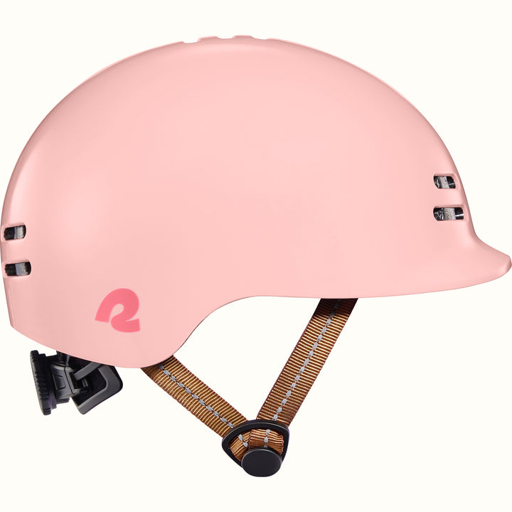 Pink toddler bike helmet with a brown strap on a white background.