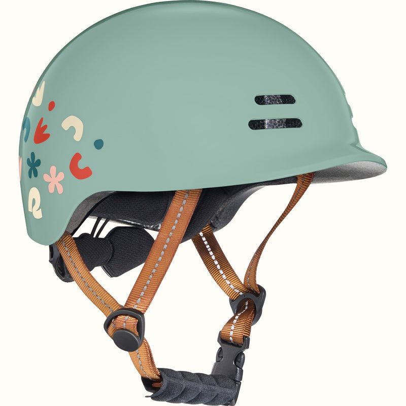 Light green toddler bike helmet with colorful graphics and a brown strap on a white background.
