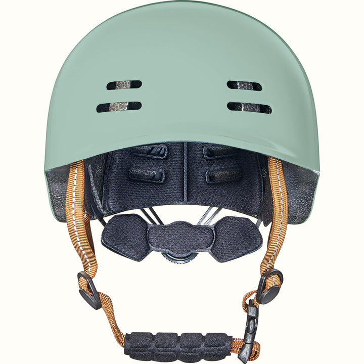 Light green toddler bike helmet with colorful graphics and a brown strap on a white background.