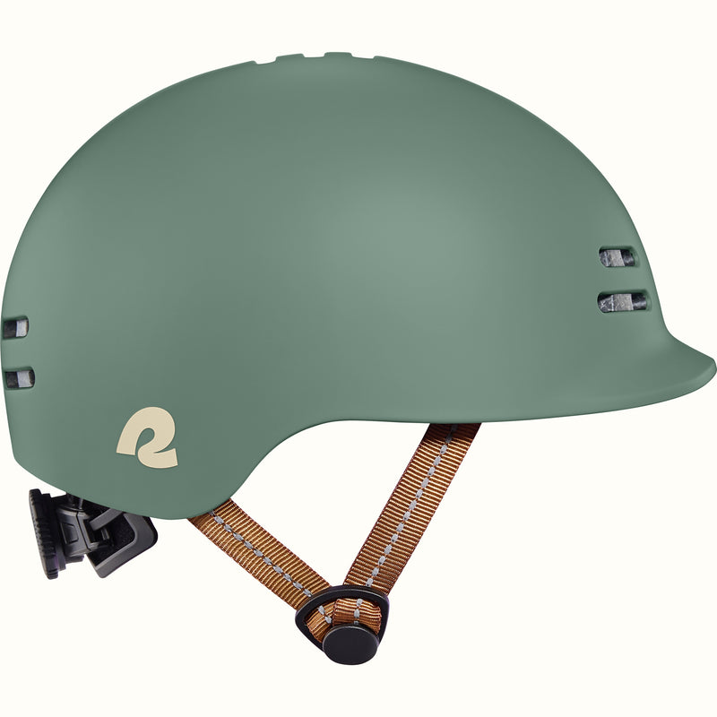 Green toddler bike helmet with a brown strap on a white background.