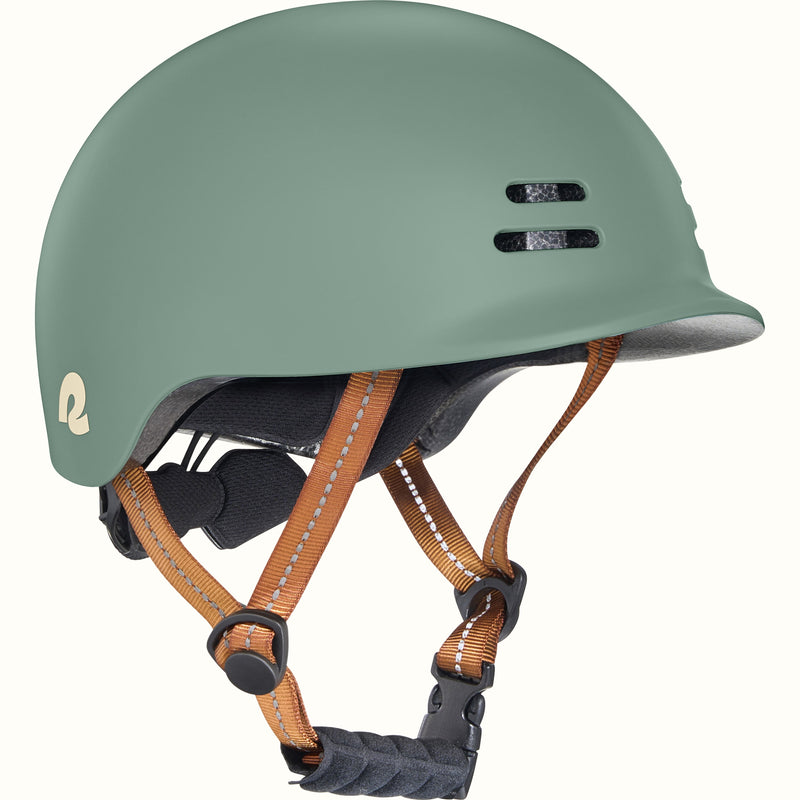 Green toddler bike helmet with a brown strap on a white background.