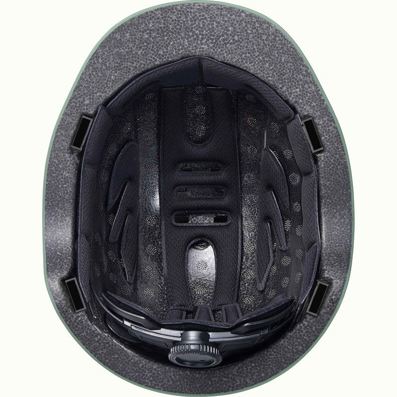 Close-up of the black interior of the Remi Toddler Bike Helmet revealing padding and an adjustable dial.