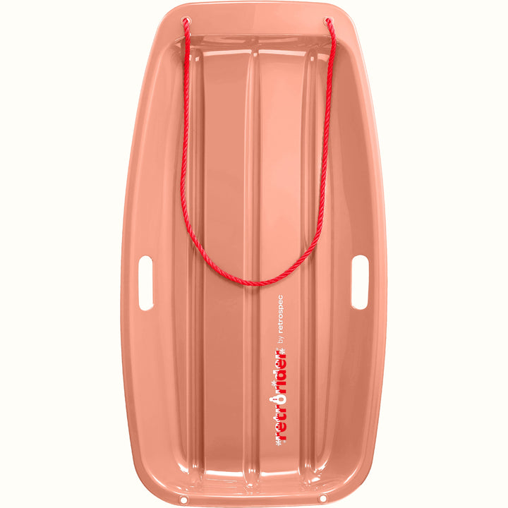 Retrorider Toboggan Snow Sled - 35” in Polar Pink with a red rope on a white background.