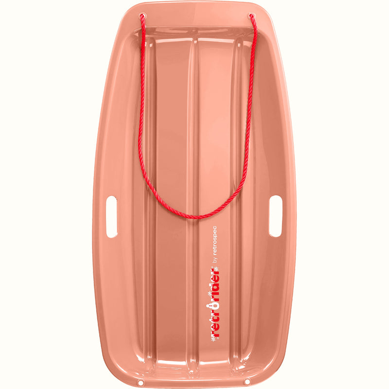 Retrorider Toboggan Snow Sled - 35” in Polar Pink with a red rope on a white background.