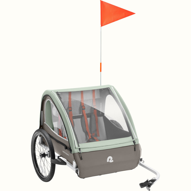 Child bike trailer with a red flag on a white background.