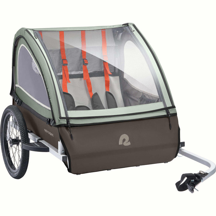 A Rover Plus Child Double bike trailer with a mesh front, featuring orange harness straps and a sturdy frame, designed for safety and comfort.