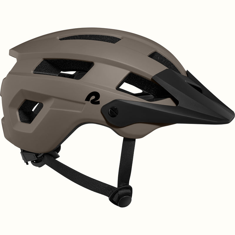 A sleek, modern mountain bike helmet in iron gray with ventilation slots and a black visor, designed for safety and style.
