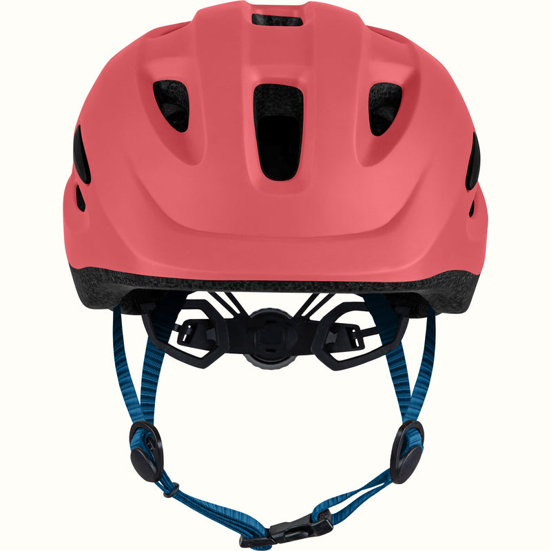 Coral helmet with blue strap on a white background.