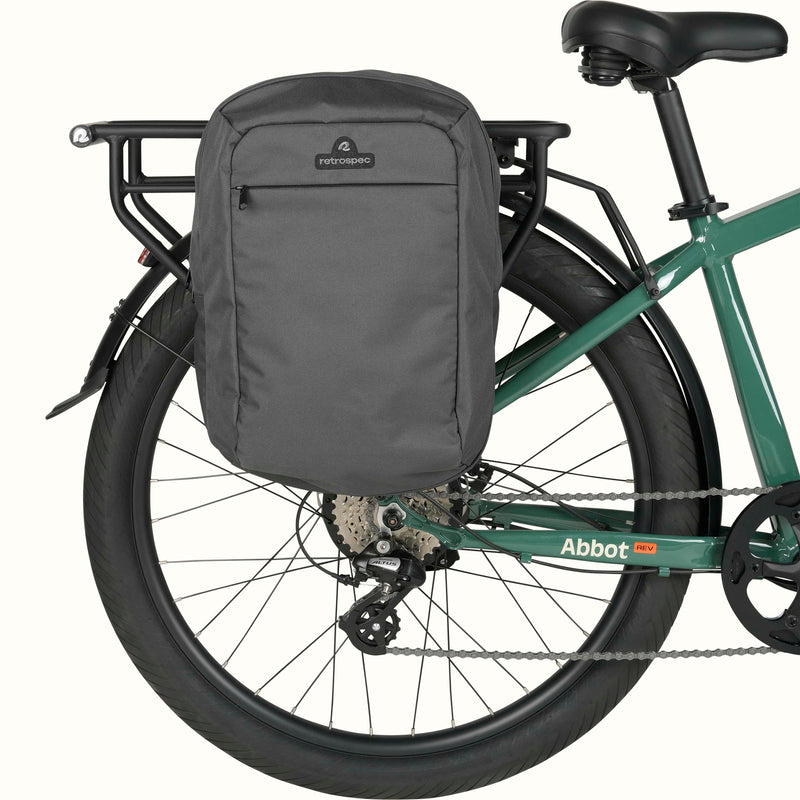 Gray Sidekick Duo Saddle Bag mounted on a green retrospec Abbott Rev EBike's rear rack.