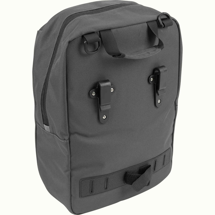 Gray pannier with handle, strap D rings, black clips and velcro fasteners.