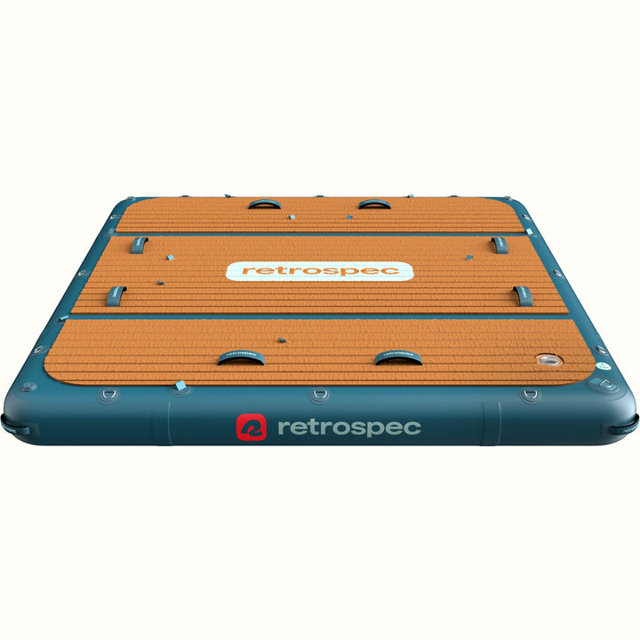 A floating water mat labeled "Siesta Dock" with a non-slip surface and blue edges.