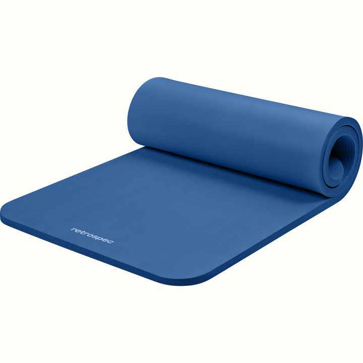 Blue Solana 1" Yoga Mat rolled up on a white background.