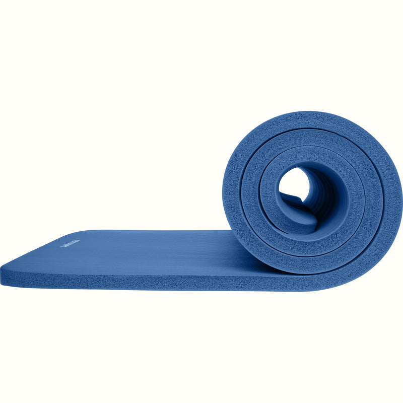 Blue Solana 1" Yoga Mat with a hole in the center on a white background.
