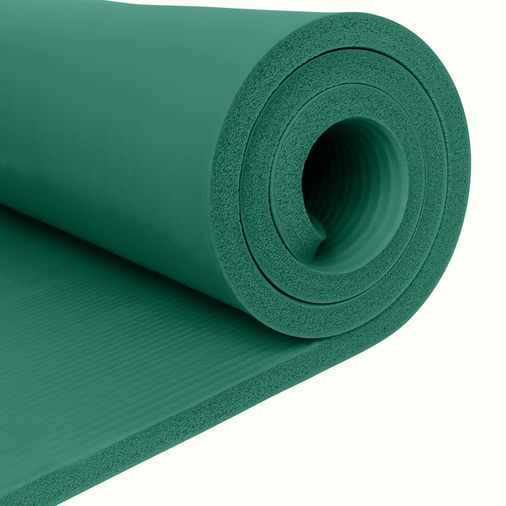 Close-up of a green Solana 1" Yoga Mat  on a white background.