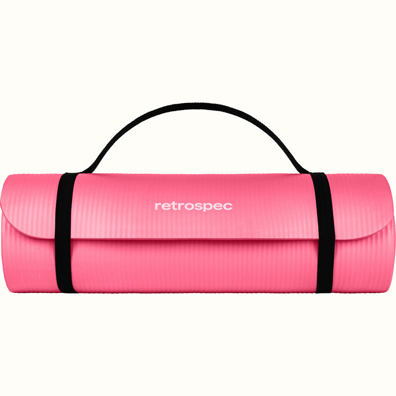 Pink Solana 1" Yoga Mat rolled up and secured with black straps on a white background, featuring the retrospec brand.