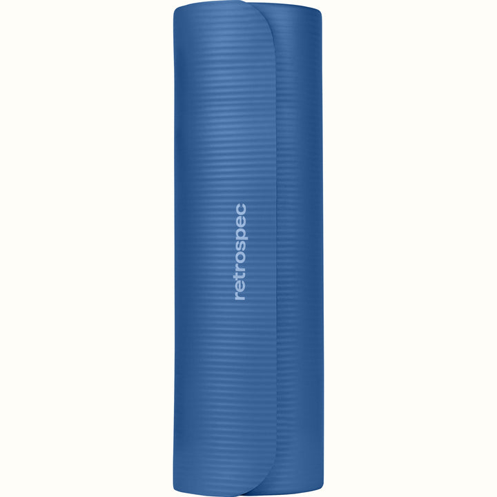 Rolled up blue Solana .5" Yoga Mat with 'retrospec' branding on a white background.