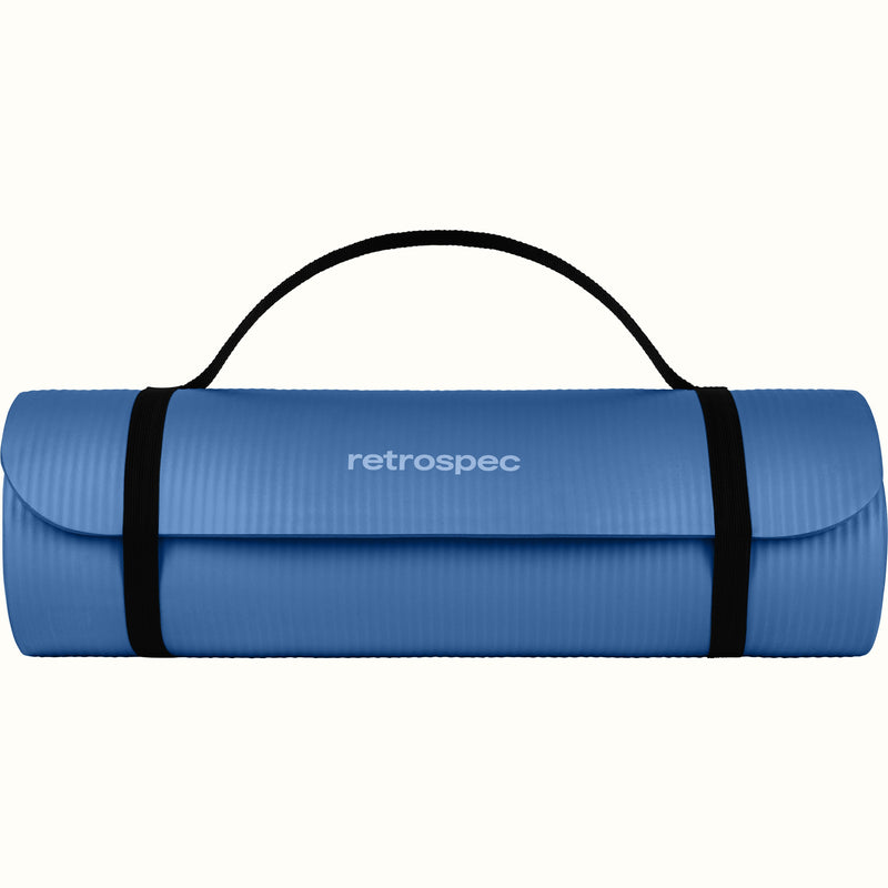 Blue Solana .5" Yoga Mat rolled up and secured with black straps and 'retrospec' branding on a white background.