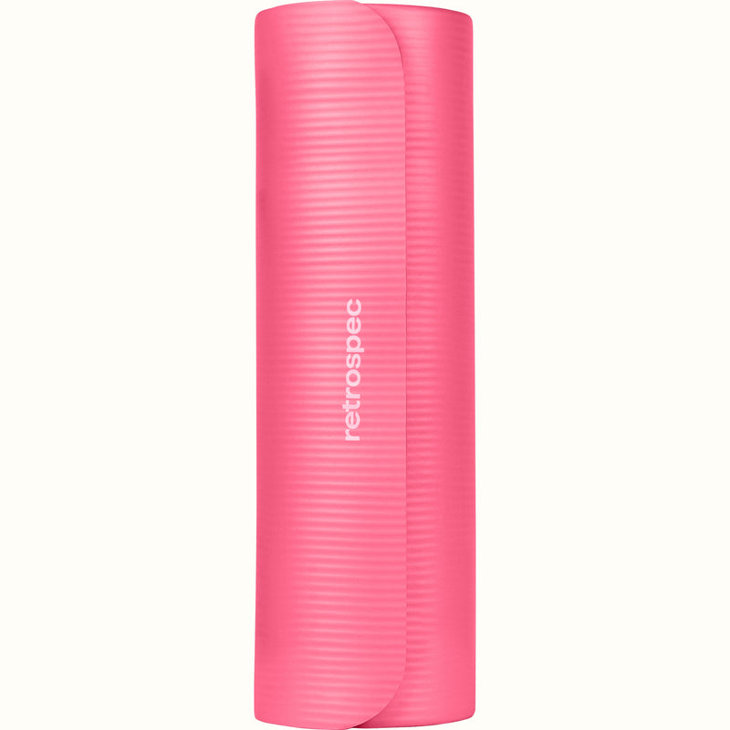 Rolled up pink Solana .5" Yoga Mat with 'retrospec' branding on a white background.